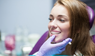 Dentist checking placement of a Same-Day Crown on a patient